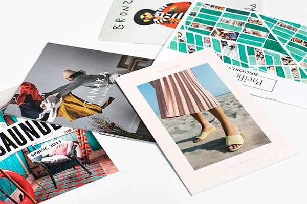 Printed books splayed on a table